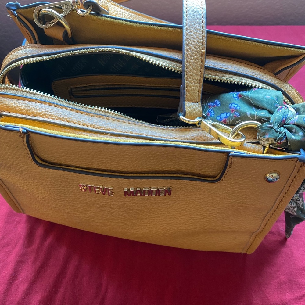 Yellow Steve Madden purse with green tie